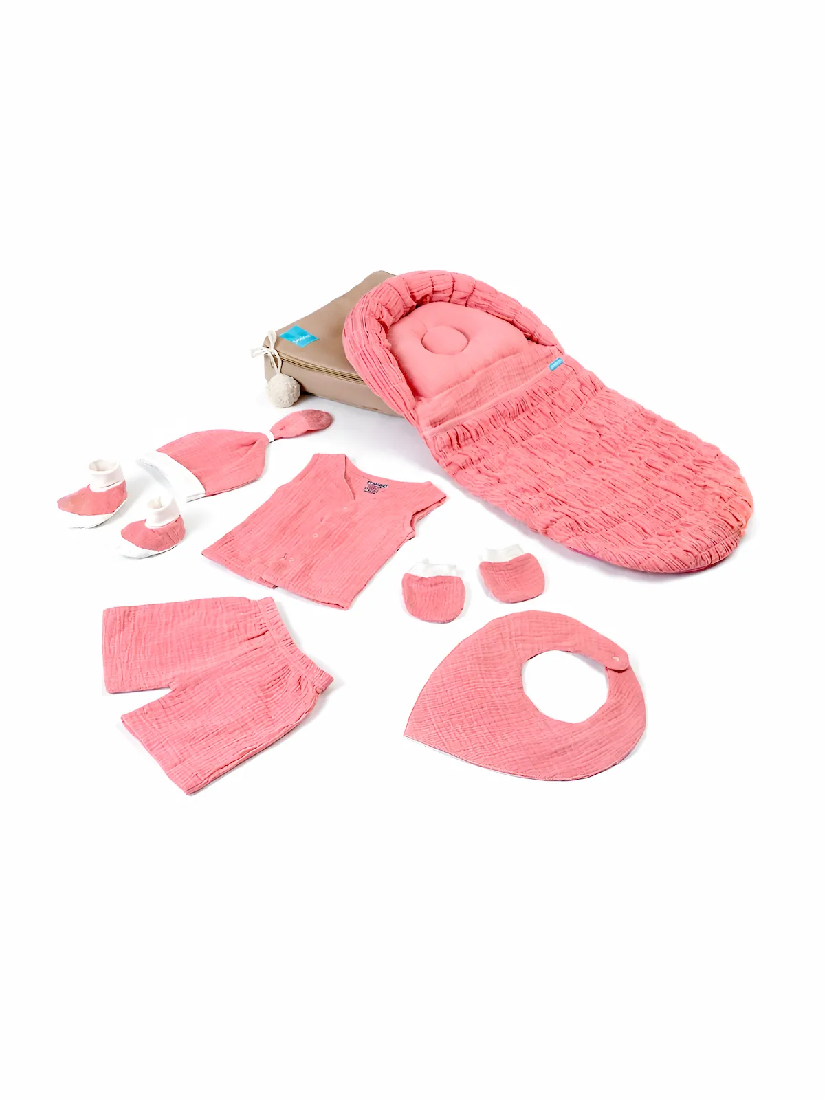pink muslin baby set for newborn with baby nest, clothes, mittens, booties and bib.